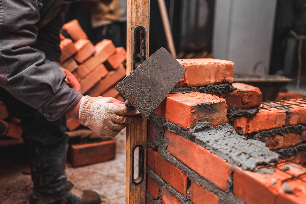 bricklayer-puts-bricks-make-wall.jpg
